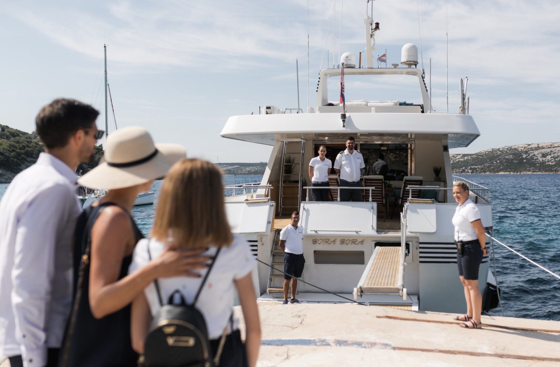 Hosts awaiting guests on yacht charter